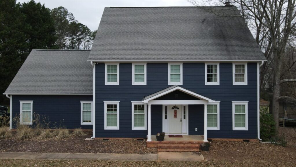 Front of a home with new blue james hardie siding