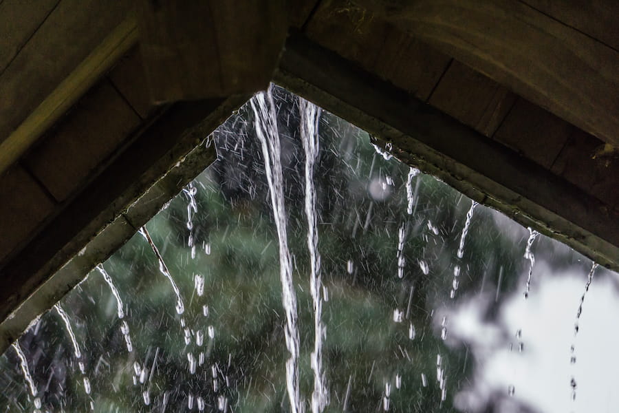 Raindrops Stream Off Of A Roof In Renton, Washington.
