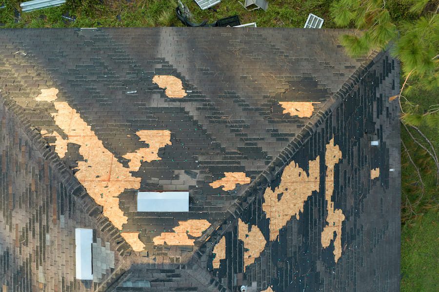 Damaged Roof After Storm with Missing Shingles