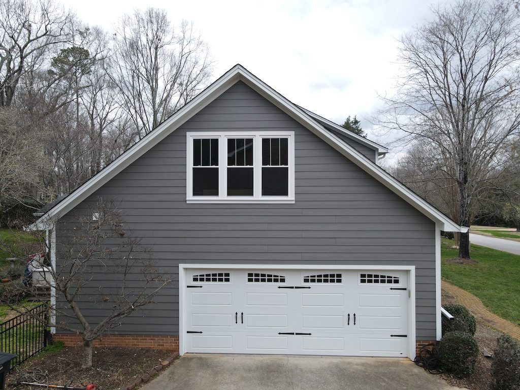 Steep asphalt shingle roof designed for efficient water drainage